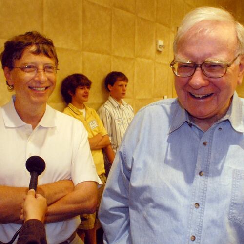 FILE - Microsoft co-founder and chairman Bill Gates, left, and Berkshire Hathaway Inc. billionaire Warren Buffett laugh while answering questions Aug 5, 2006, before the Nebraska Regional Bridge tournament in Council Bluffs, Iowa. (AP Photo/Dave Weaver, File)