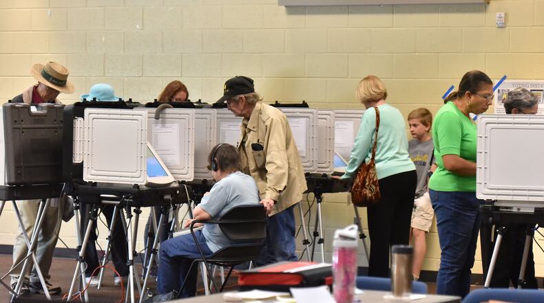 Early voters cast their votes at George Pierce Park Community Recreation Center in Suwanee on Wednesday, Oct. 26, 2016. HYOSUB SHIN / HSHIN@AJC.COM