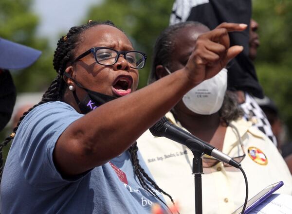 Georgia Representative Kim Schofield, D - Atlanta,  speaks to the crowd gathered at Wendy's on University Avenue on Sunday, June 14, 2020. On Saturday, protesters set fire to the Atlanta Wendy's where Rayshard Brooks, a 27-year-old black man, was shot and killed by Atlanta police Friday evening during a struggle in a Wendy's drive-thru line. (Steve Schaefer for The Atlanta Journal-Constitution)