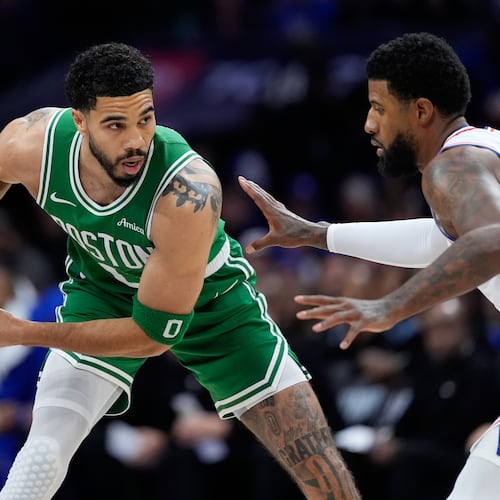 Boston Celtics' Jayson Tatum, left, tries to get past Philadelphia 76ers' Paul George during the first half of Game 6 in a first-round NBA basketball playoff series Thursday, April 30, 2026, in Philadelphia. (AP Photo/Matt Slocum)