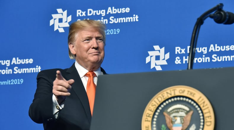 President Donald Trump reacts after he was introduced during his last visit to Atlanta in April for an opioid summit. HYOSUB SHIN / HSHIN@AJC.COM