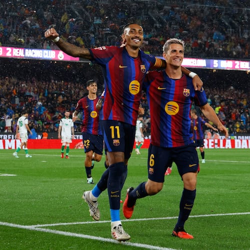 Barcelona's Raphinha celebrates with Gavi, right, after scoring his side's fifth goal from the penalty spot during a Spanish La Liga soccer match between Barcelona and Racing de Santander in Barcelona, Spain, Wednesday, Sept. 16, 2026. (AP Photo/Joan Monfort)
