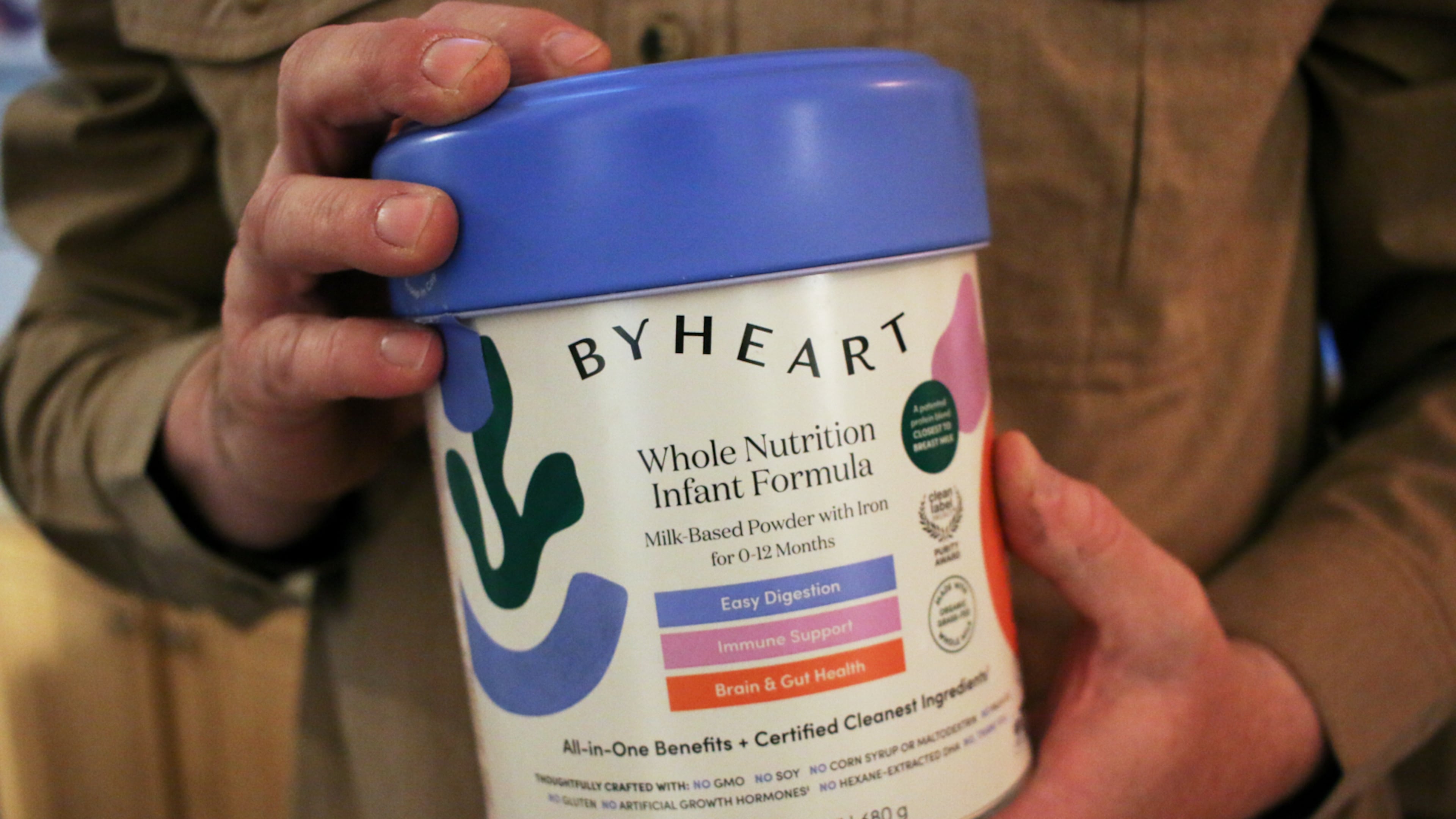 Stephen Dexter holds a container of ByHeart baby formula, which was recently recalled by ByHeart, in Flagstaff, Ariz., on Wednesday, Nov. 12, 2025. (AP Photo/Cheyanne Mumphrey)