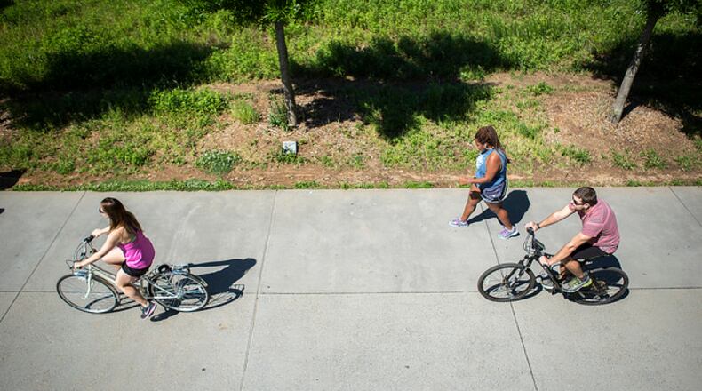 People bike along the Eastside Trail in April 2016.