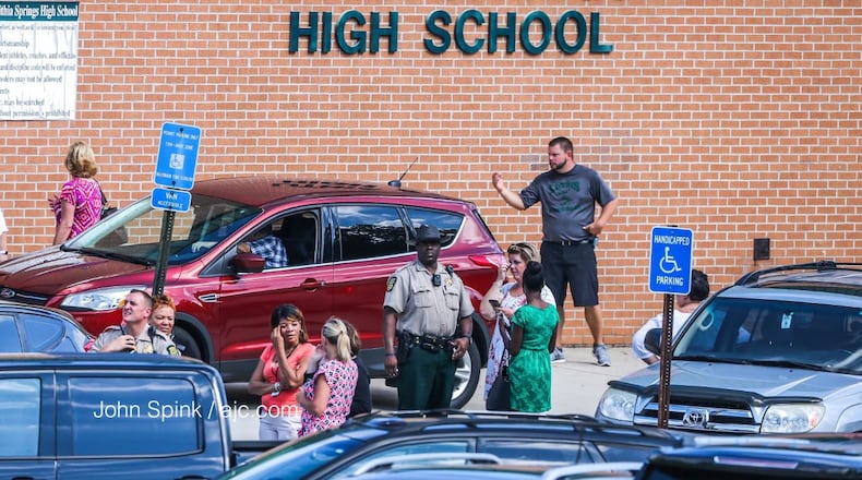 Classes were canceled Thursday at Lithia Springs High School after a veteran teacher shot himself inside his classroom. JOHN SPINK / JSPINK@AJC.COM