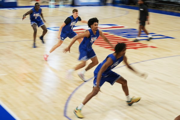 Khaman Maluach, from rear left, and Cooper Flagg, Dylan Harper and Tre Johnson participate in the 2025 NBA basketball draft combine in Chicago, Tuesday, May 13, 2025. (AP Photo/Nam Y. Huh)