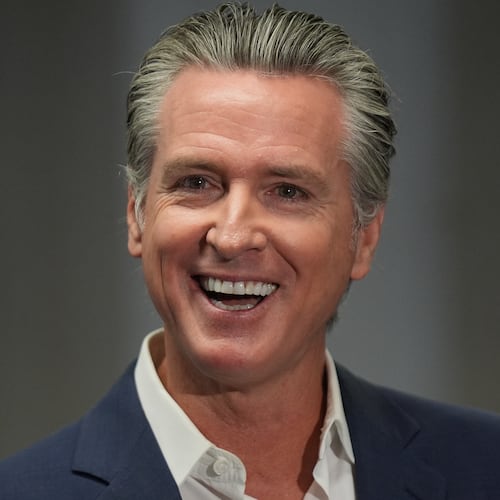 California Gov. Gavin Newsom smiles after signing legislation related to student literacy in Los Angeles on Thursday, Oct. 9, 2025. (AP Photo/Damian Dovarganes)