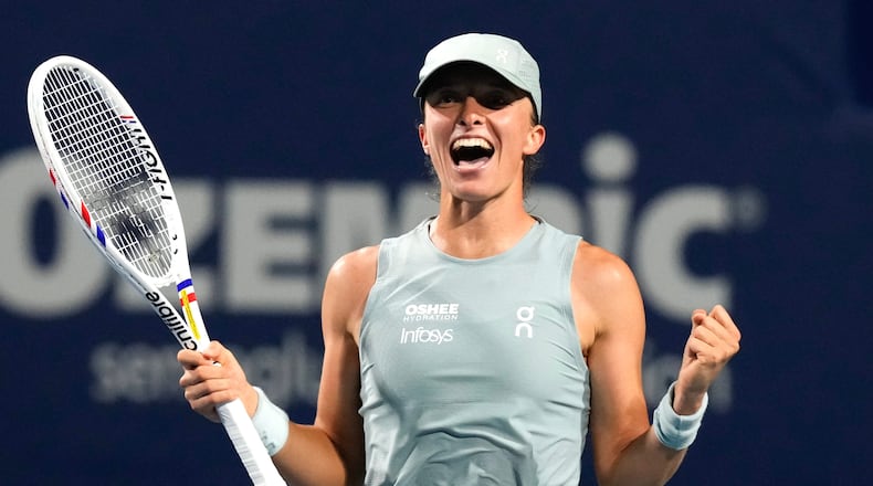 Poland's Iga Swiatek celebrates her 6-3 1-6 6-3 win over Ukraine's Elina Svitolina in a National Bank Open semifinal tennis match in Toronto on Wednesday, August 12, 2026. (Chris Young/The Canadian Press via AP)
