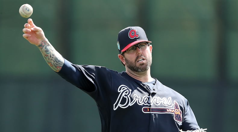 Peter Moylan gets loose during Tuesday's  workout after signing with the Braves on Monday.