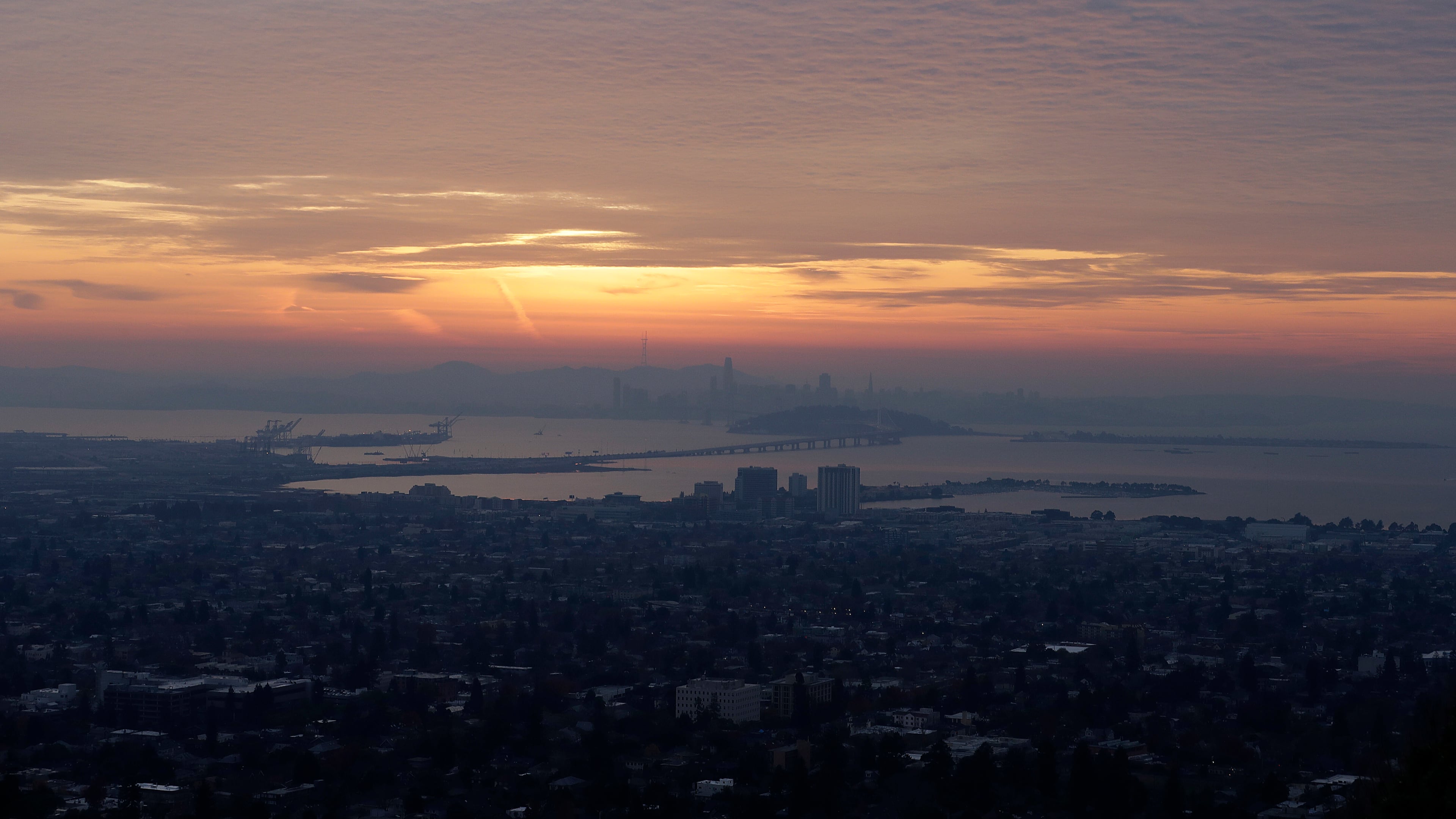 FILE - The San Francisco skyline and the eastern span of the Bay Bridge are shown from Berkeley, Calif., Dec. 22, 2017. (AP Photo/Jeff Chiu, file)