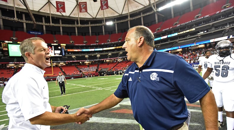 COACH SHAKE--August 22, 2015 Atlanta - Former Valdosta head coach Rance Gillespie (left) and Norcross head coach Keith Maloof shake hands in the Corky Kell Classic at the Georgia Dome on Saturday, August 22, 2015. Norcross won 34 - 31 over Valdosta. HYOSUB SHIN / HSHIN@AJC.COM