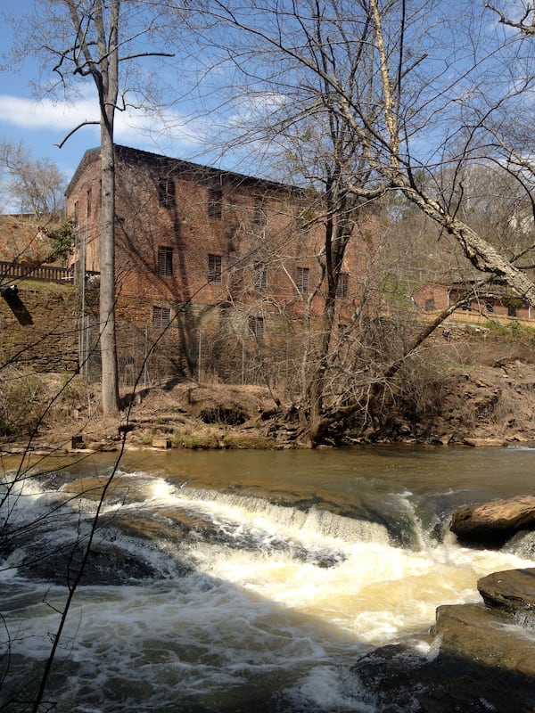 The historic Roswell Mill towers above the waters of Vickery Creek. (Courtesy of Jonah McDonald)