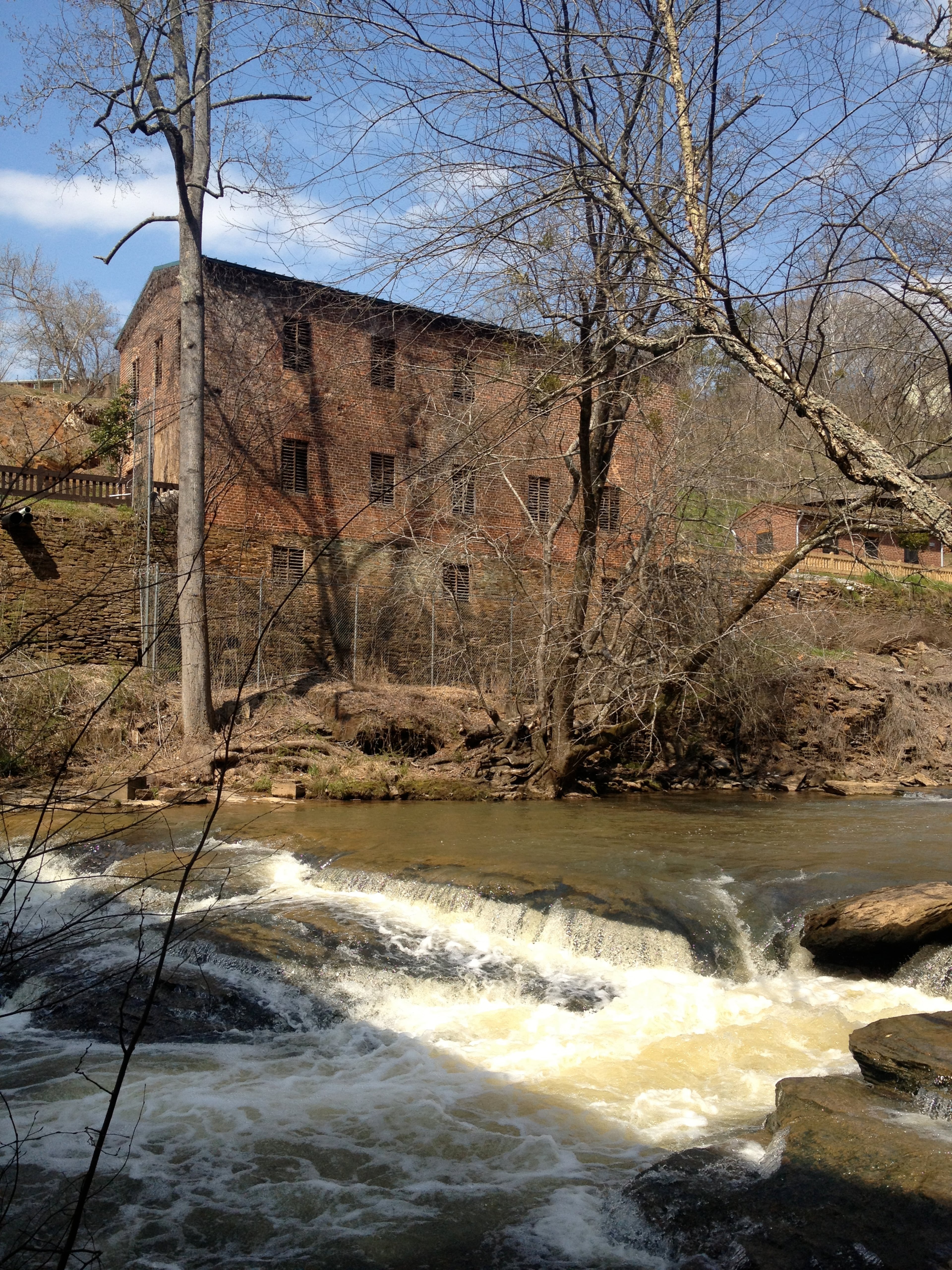 The historic Roswell Mill towers above the waters of Vickery Creek. (Courtesy of Jonah McDonald)