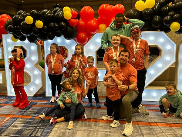 Bert's Big Adventure is now in its 21st year and took a dozen families to Disney in Orlando Feb. 23-26, 2024. Here they are at the kickoff party at the Atlanta Airport Hilton Feb. 23. RODNEY HO/rho@ajc.com