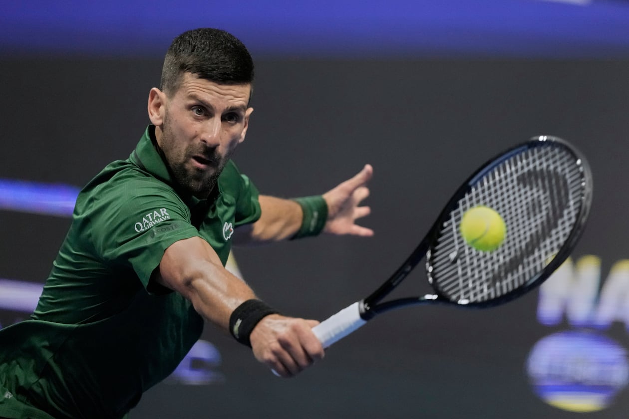 Novak Djokovic of Serbia plays a shot against Alejandro Tabilo of Chile during the ATP tournament round of 16 tennis match, in Athens, Greece, Tuesday, Nov. 4, 2025. (AP Photo/Petros Giannakouris)