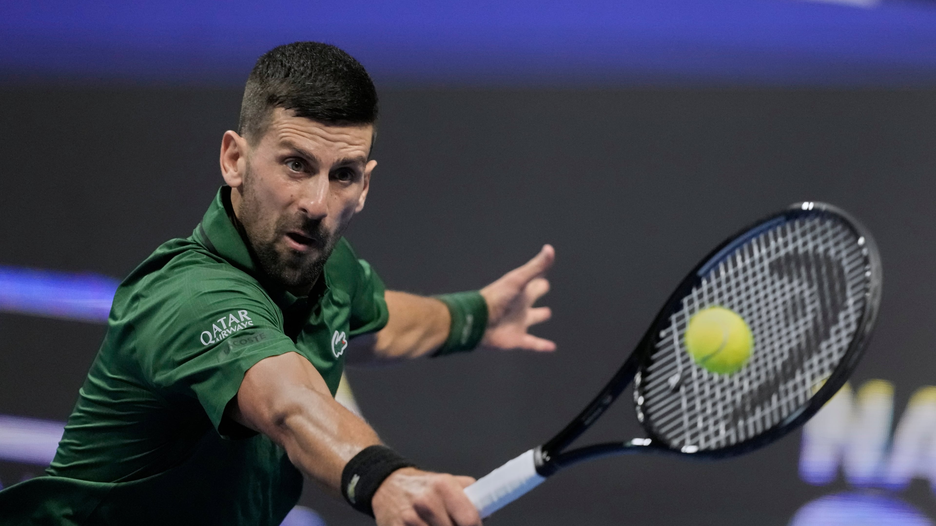 Novak Djokovic of Serbia plays a shot against Alejandro Tabilo of Chile during the ATP tournament round of 16 tennis match, in Athens, Greece, Tuesday, Nov. 4, 2025. (AP Photo/Petros Giannakouris)