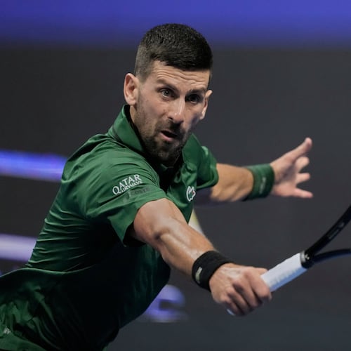 Novak Djokovic of Serbia plays a shot against Alejandro Tabilo of Chile during the ATP tournament round of 16 tennis match, in Athens, Greece, Tuesday, Nov. 4, 2025. (AP Photo/Petros Giannakouris)