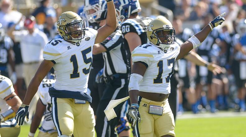 Sophomore DB A.J. Gray (15) and junior DB Lance Austin (17) signal a turnover after a play in the first half of Georgia Tech’s game against Duke Saturday, October 29, 2016. SPECIAL/Daniel Varnado