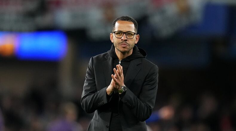 Chelsea's head coach Liam Rosenior leaves the field after the English Premier League soccer match between Chelsea and Manchester United in London, Saturday, April 18, 2026. (AP Photo/Kirsty Wigglesworth)
