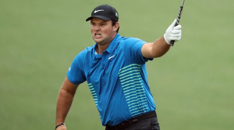 Patrick Reed celebrates his eagle chip on fifteen during the third round of the Masters Tournament Saturday, April 7, 2018, at Augusta National Golf Club. PHOTO / JASON GETZ