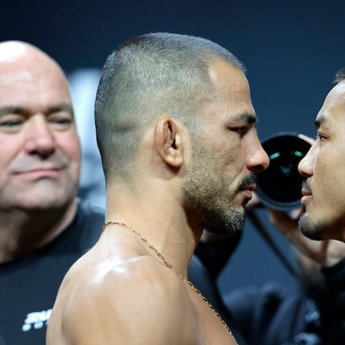 FILE - UFC flyweight champion Alexandre Pantoja, left, of Brazil, and Joshua Van, originally of Myanmar, face off during a ceremonial weigh-in for UFC 323 Friday, Dec. 5, 2025, in Las Vegas (Steve Marcus/Las Vegas Sun via AP,File)