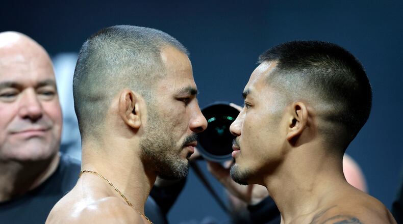 FILE - UFC flyweight champion Alexandre Pantoja, left, of Brazil, and Joshua Van, originally of Myanmar, face off during a ceremonial weigh-in for UFC 323 Friday, Dec. 5, 2025, in Las Vegas (Steve Marcus/Las Vegas Sun via AP,File)