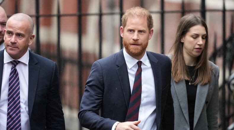 FILE - Britain's Prince Harry arrives at London's High Court to lead a group, including Elton John and Elizabeth Hurley, accusing the Daily Mail's publisher of privacy invasion through unlawful tactics in a trial that is part of a wider phone hacking scandal in London, Jan. 21, 2026. (AP Photo/Kirsty Wigglesworth, File)