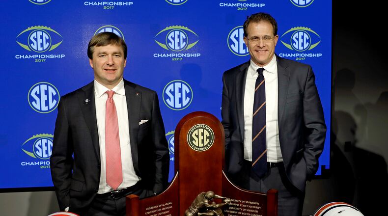 Two men, two helmets, one trophy.