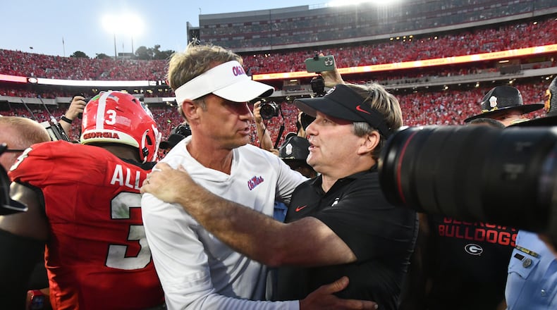 Georgia head coach Kirby Smart and Mississippi head coach Lane Kiffin shake hands after Georgia beat Mississippi during an NCAA football game at Sanford Stadium, Saturday, Oct. 18, 2025, in Athens. (Hyosub Shin/AJC)