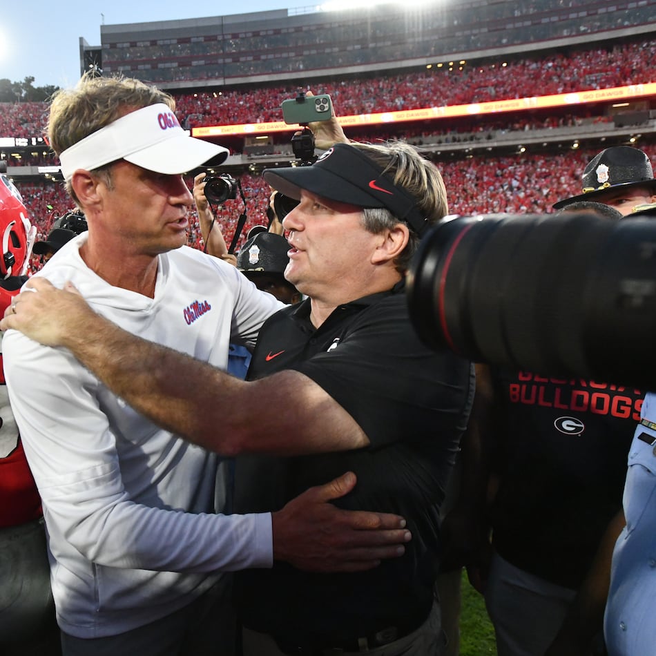 Georgia head coach Kirby Smart and Mississippi head coach Lane Kiffin shake hands after Georgia beat Mississippi during an NCAA football game at Sanford Stadium, Saturday, Oct. 18, 2025, in Athens. (Hyosub Shin/AJC)