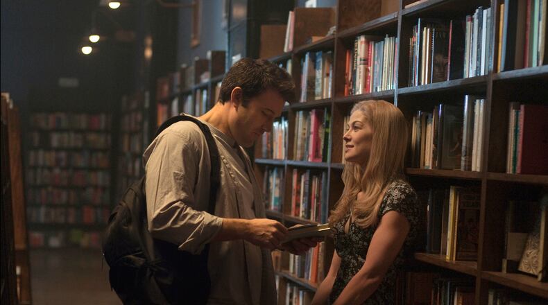 In this image released by 20th Century Fox, Ben Affleck, left, and Rosamund Pike appear in a scene from "Gone Girl." (AP Photo/20th Century Fox, Merrick Morton)