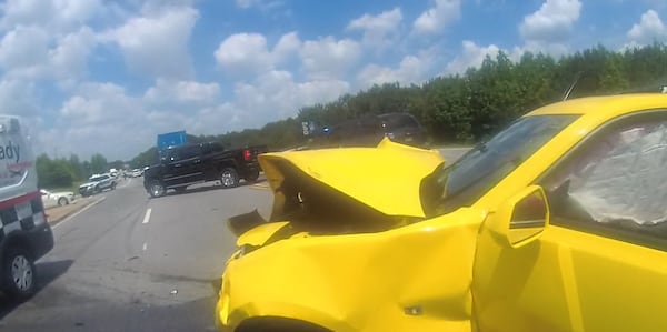 The yellow Chevrolet Camaro driven by Jerry Devaun Bates is seen on body-camera video after a collision on June 2, 2020. (Courtesy of College Park Police Department)