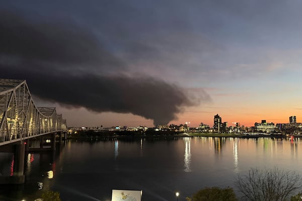 This photo provided by Chuck Fugate shows thick, black smoke rising after reports of a plane crash at Louisville Muhammad Ali International Airport on Tuesday, Nov. 4, 2025, as seen from Fugate's condo in Jeffersonville, Ind. (Chuck Fugate via AP)