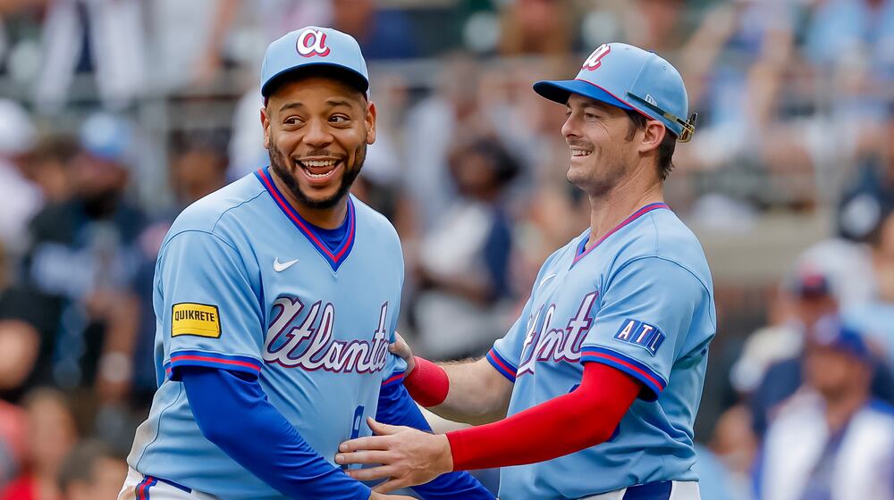 Atlanta Braves' Dominic Smith, left, reacts with teammate Mike Yastrzemski, right, after the Braves defeated the Pittsburgh Pirates in a baseball game, Saturday, June 6, 2026, in Atlanta. (AP Photo/Erik S. Lesser)