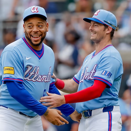 Atlanta Braves' Dominic Smith, left, reacts with teammate Mike Yastrzemski, right, after the Braves defeated the Pittsburgh Pirates in a baseball game, Saturday, June 6, 2026, in Atlanta. (AP Photo/Erik S. Lesser)