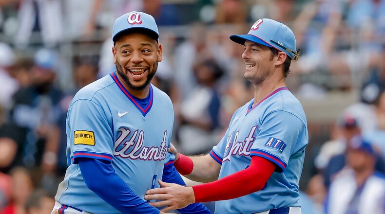 Atlanta Braves' Dominic Smith, left, reacts with teammate Mike Yastrzemski, right, after the Braves defeated the Pittsburgh Pirates in a baseball game, Saturday, June 6, 2026, in Atlanta. (AP Photo/Erik S. Lesser)