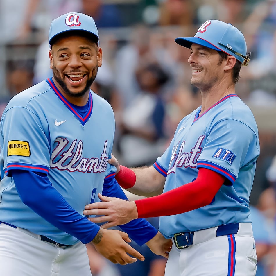 Atlanta Braves' Dominic Smith, left, reacts with teammate Mike Yastrzemski, right, after the Braves defeated the Pittsburgh Pirates in a baseball game, Saturday, June 6, 2026, in Atlanta. (AP Photo/Erik S. Lesser)