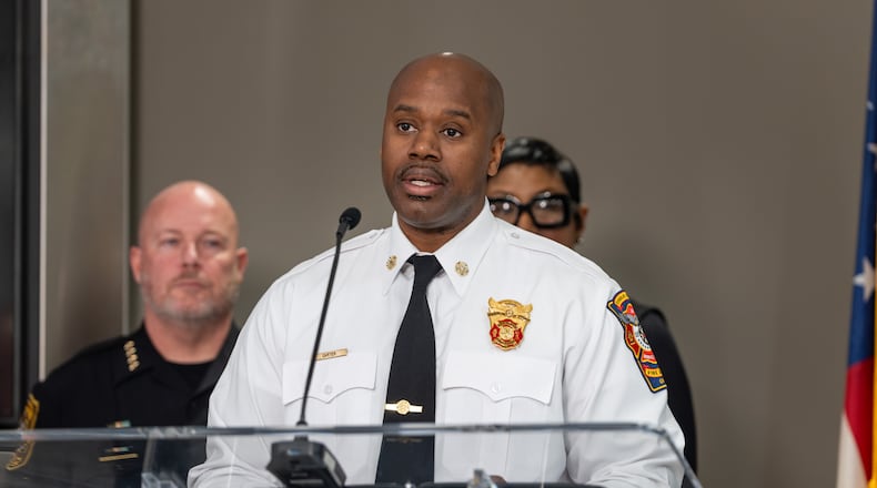 Dekalb County interim Fire Chief Melvin Carter joined other county officials at a news conference Tuesday about a string of about 15 brush fires that officials say were set within a seven-hour period in the Clarkston area. (Ben Hendren for the AJC)
