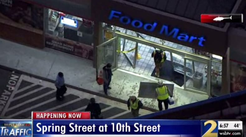 A car rolled into a food mart Monday morning at the Chevron station at the corner of Spring and 10th streets.