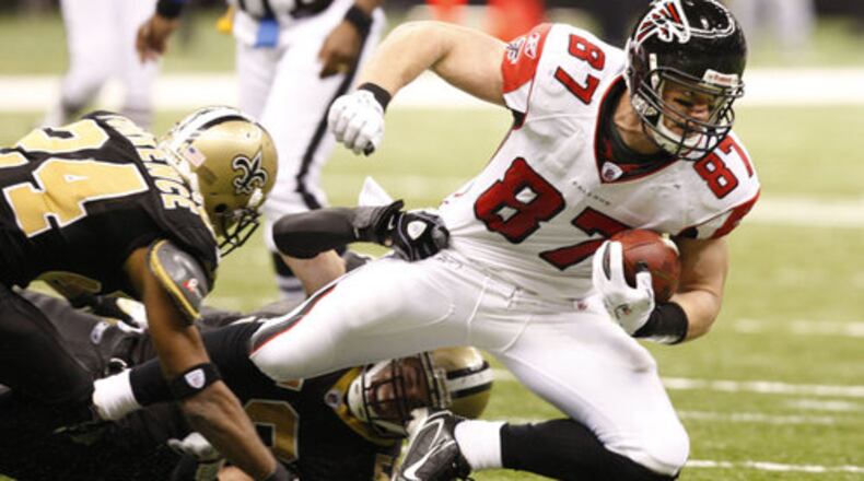 Falcons tight end Justin Peelle is dragged down after his one catch of the day for 9 yards.