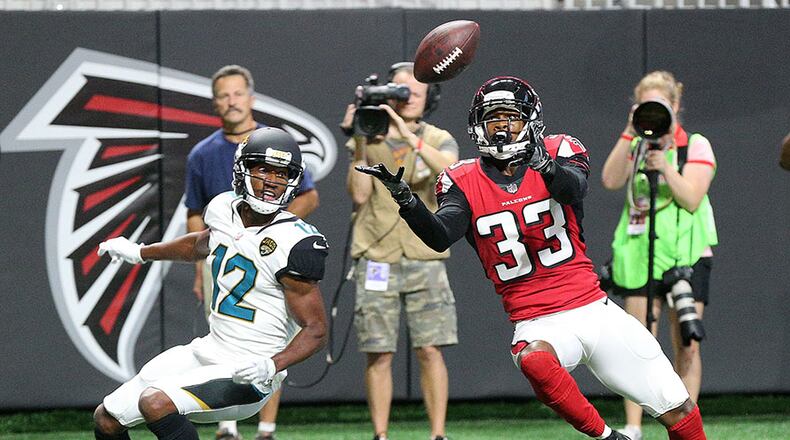 Falcons cornerback Blidi Wreh-Wilson intercepts the ball in front of Jaguars wide receiver Dede Westbrook in the endzone during the first quarter in a NFL preseason football game on Thursday, Aug. 31, 2017, in Atlanta.