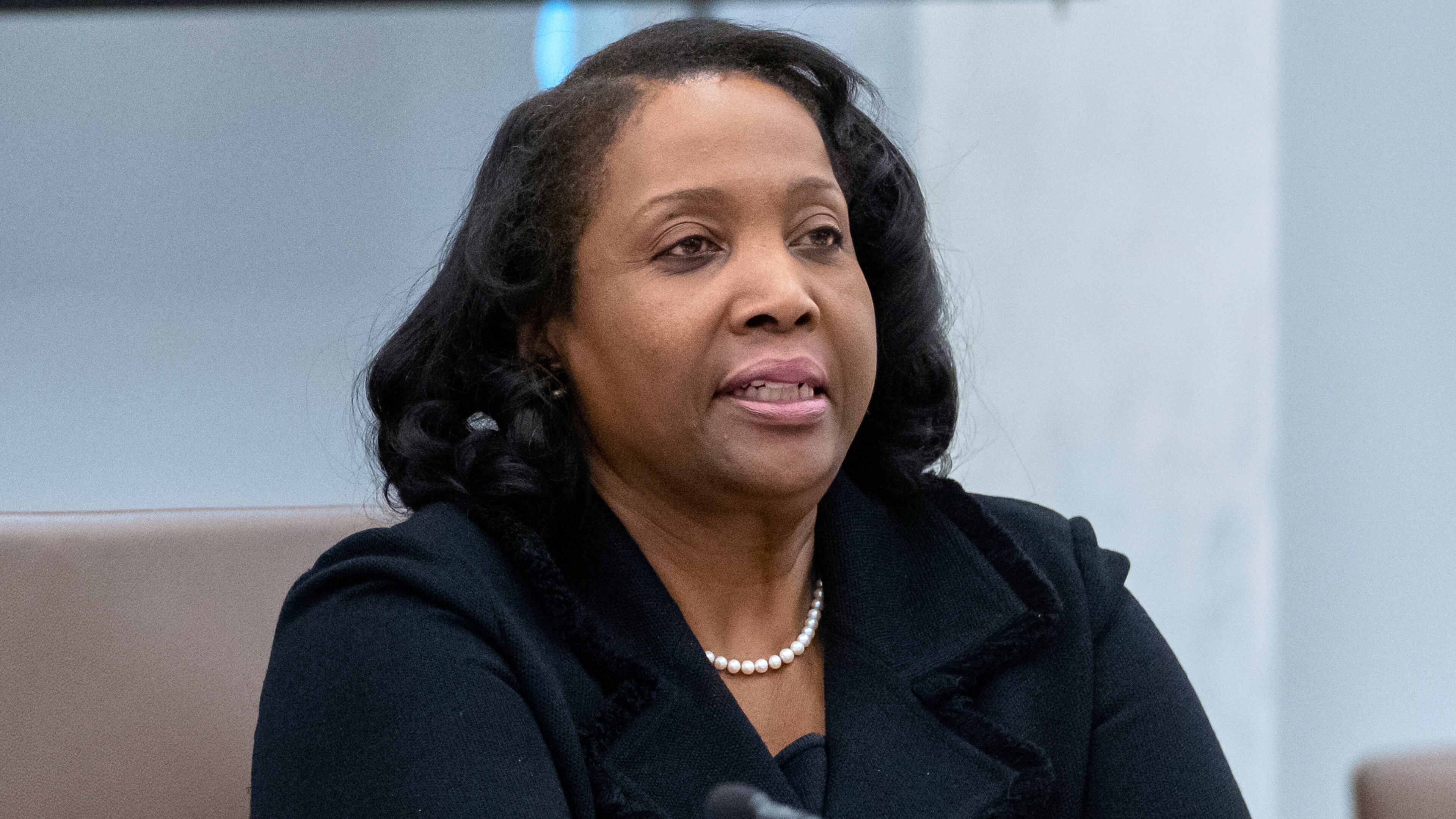 FILE - Federal Reserve Board of Governors member Lisa Cook listens during an open meeting of the Board of Governors at the Federal Reserve, June 25, 2025, in Washington. (AP Photo/Mark Schiefelbein, File)