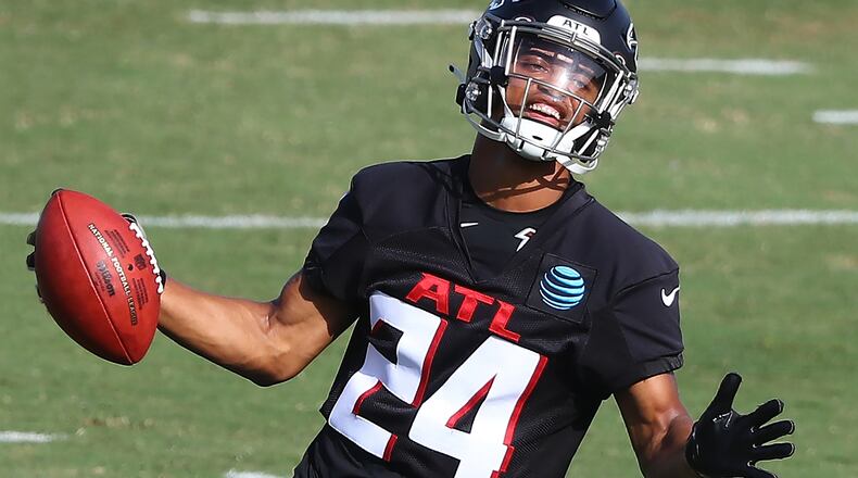 Falcons cornerback A.J. Terrell comes up with the interception while running a defensive drill during training camp Thursday, August 27, 2020 in Flowery Branch.    Curtis Compton ccompton@ajc.com
