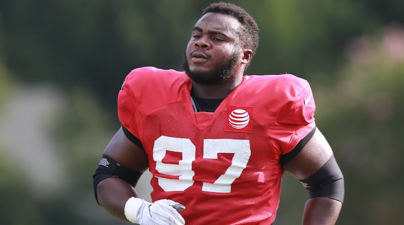 Atlanta Falcons defensive tackle Grady Jarrett loosens up during a NFL football training camp practice on Tuesday, August 7, 2018, in Flowery Branch.