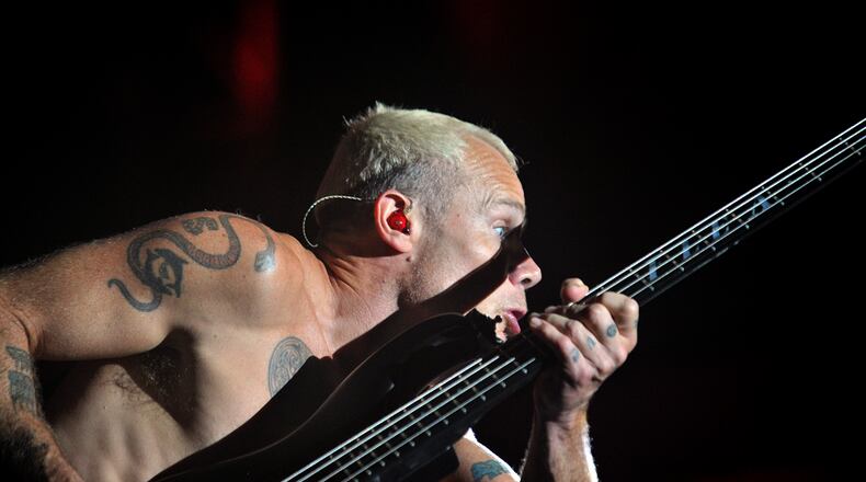 September 21, 2013 Atlanta - Red Hot Chili Peppers bassist Michael Peter Balzary performs during Day 2 of Music Midtown 2013 at Piedmont Park in Atlanta on Saturday, September 21, 2013. HYOSUB SHIN / HSHIN@AJC.COM