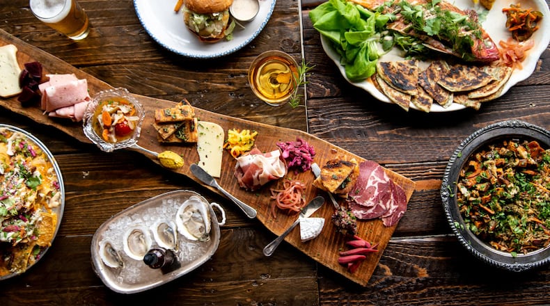 Best End Brewing Meat, Cheese, and Smears charcuterie board, House Oysters, Whole Snapper Family Meal, BE Burger, and Chicken Nachos with a draft beer and a Walk in the Woods cocktail. Photo credit- Mia Yakel.