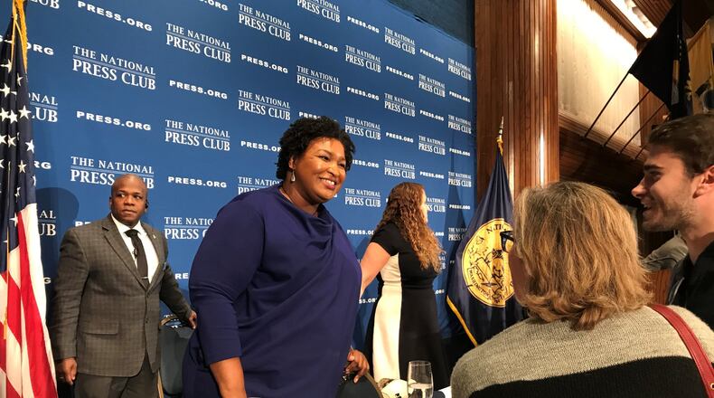 Former Democratic gubernatorial candidate Stacey Abrams speaks to guests after her speech Friday at the National Press Club in Washington. Later, she participated in a “fireside chat” with former President Barack Obama during the Democracy Alliance conference. (TIA MITCHELL/TIA.MITCHELL@AJC.COM)