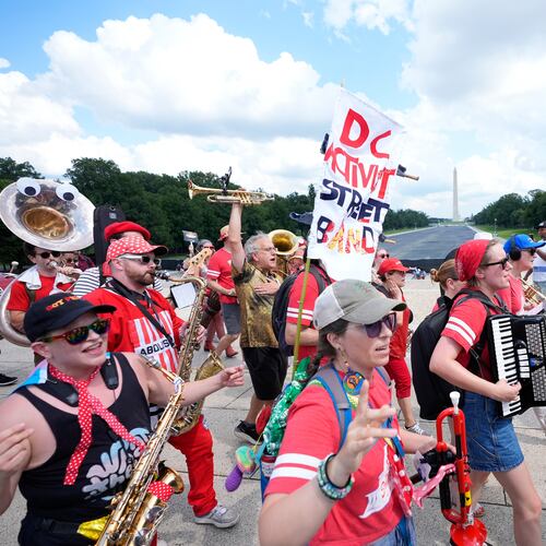 A group of local activist from Washington DC, demonstrating during the March on Washington rally at the Lincoln Memorial on the National Mall, Friday, Aug. 28, 2026 in Washington. (AP Photo/Manuel Balce Ceneta)