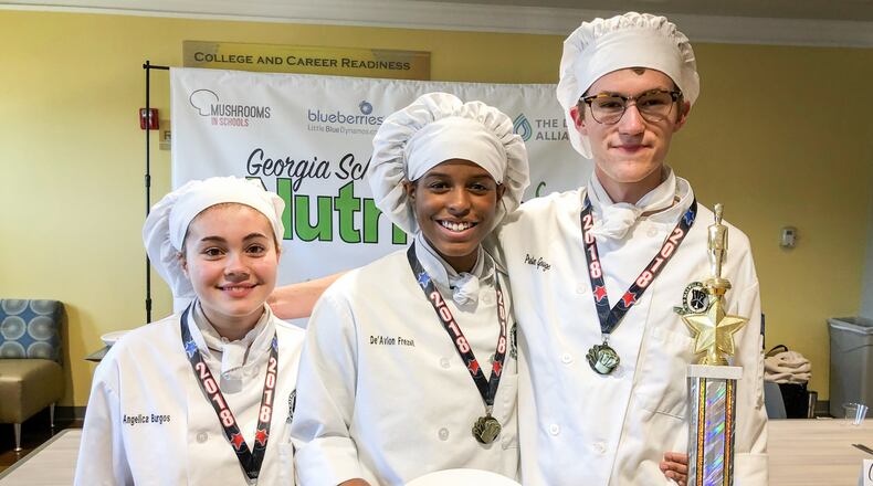 Students in the culinary arts program at Gwinnett's Maxwell High School have qualified for a regional competition in Kentucky. Pictured from left: Angélica Burgos, De’Avion Frezell, and Preston Gouge