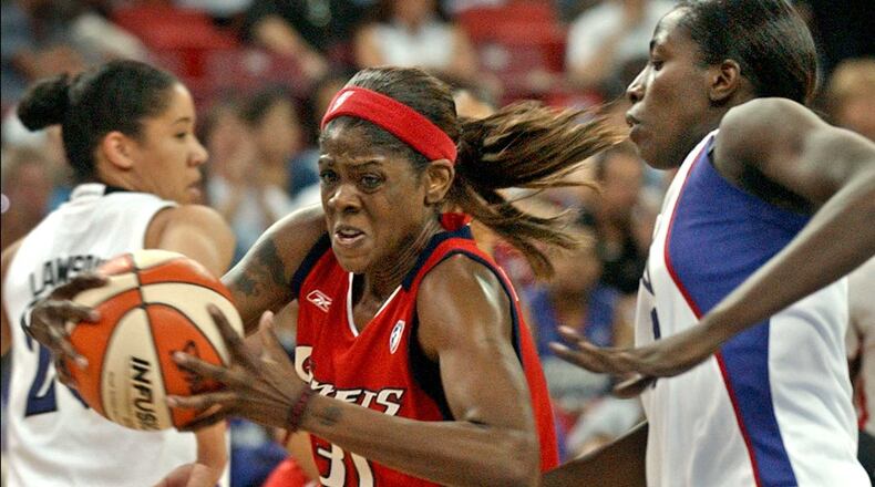 Houston Comets guard Octavia Blue, left, drives around Sacramento Monarchs guard Hamchetou Maiga in the first half in Sacramento, Calif., Saturday, Sept. 18, 2004. (AP Photo/Steve Yeater)